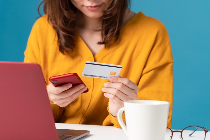 Young-asian-woman-holding-a-credit-card-Online | Personal Loans