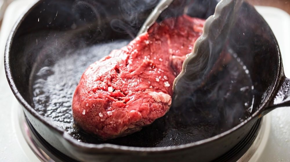 beef seared in cast iron skillet-Clyburn looks into OSHA- Meatpacking Company Investigation Underway-ss-Featured