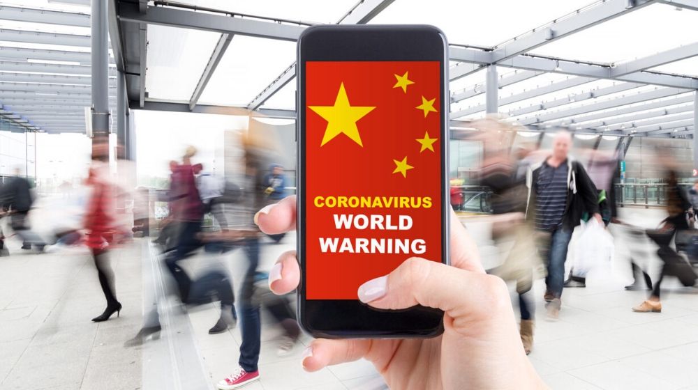 smartphone with blurred people at the background | How to Effectively Clean your Home or Business to Help Stop Coronavirus | Featured