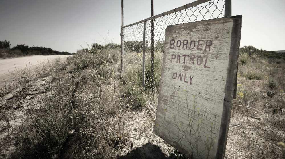 brown wooden signage on brown grass field | Guatemala Border Can't Work | Featured