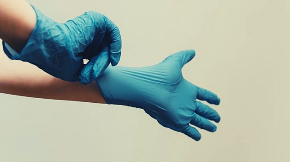 hands with medical gloves | Miss England 2019 Returns to Work as Junior Doctor to Help Fight COVID-19 | Featured