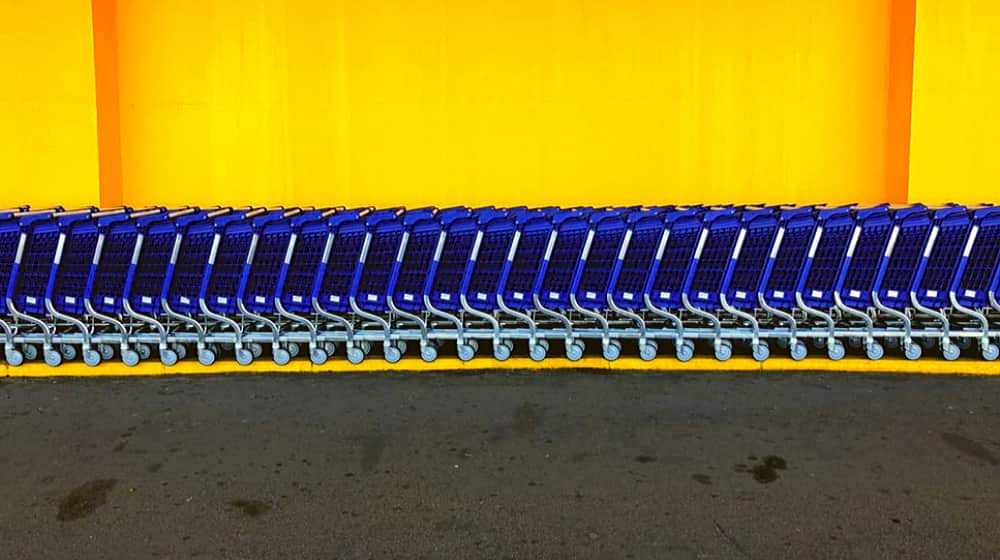 cards arranged outside the store | Walmart Raises Profits By Betraying Small Towns | featured | save money
