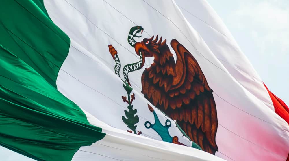 Flag of Mexico close up | Mexico’s Handling of Coronavirus Challenge Impacts the US | Featured